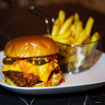 Burger and fries at SMOUK.